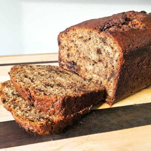 Sliced banana bread on wooden board